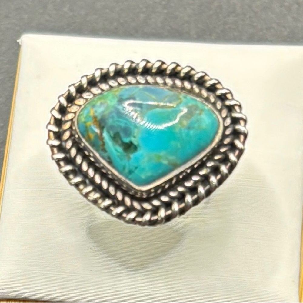 A Sterling Silver and Turquoise ring in a teardrop setting